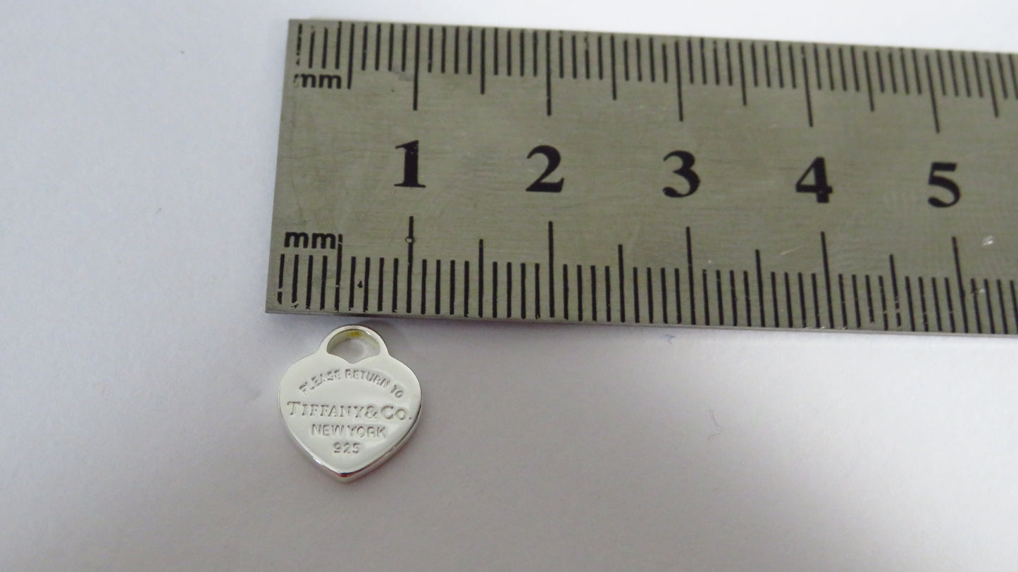 Tiffany And Co. Tiny Sterling Engraved Heart Charm!