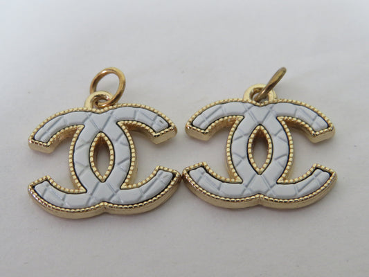 Bundle Of 2 Chanel CC White And Gold Stamped Zipper Pulls!