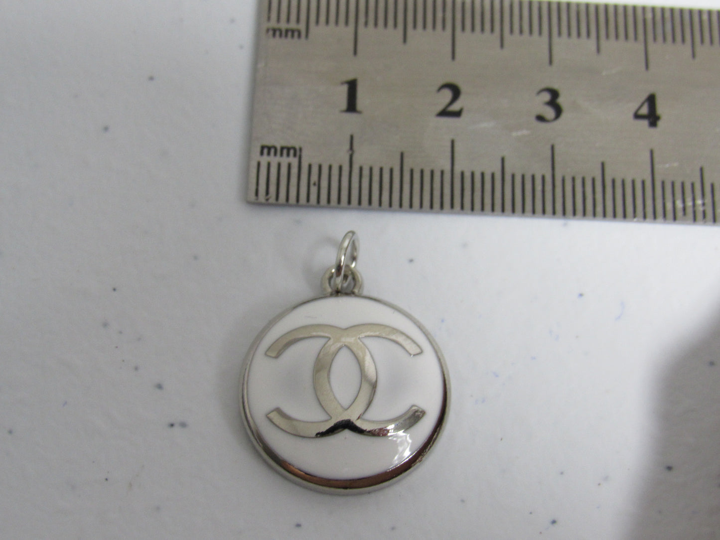 Chanel Chrome And White Concave Zipper Pull Charm!