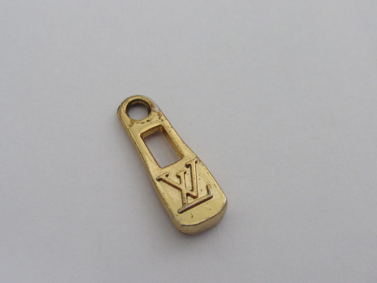 Vintage Louis Vuitton Gold Tone Embossed Bottle Cap Zipper!