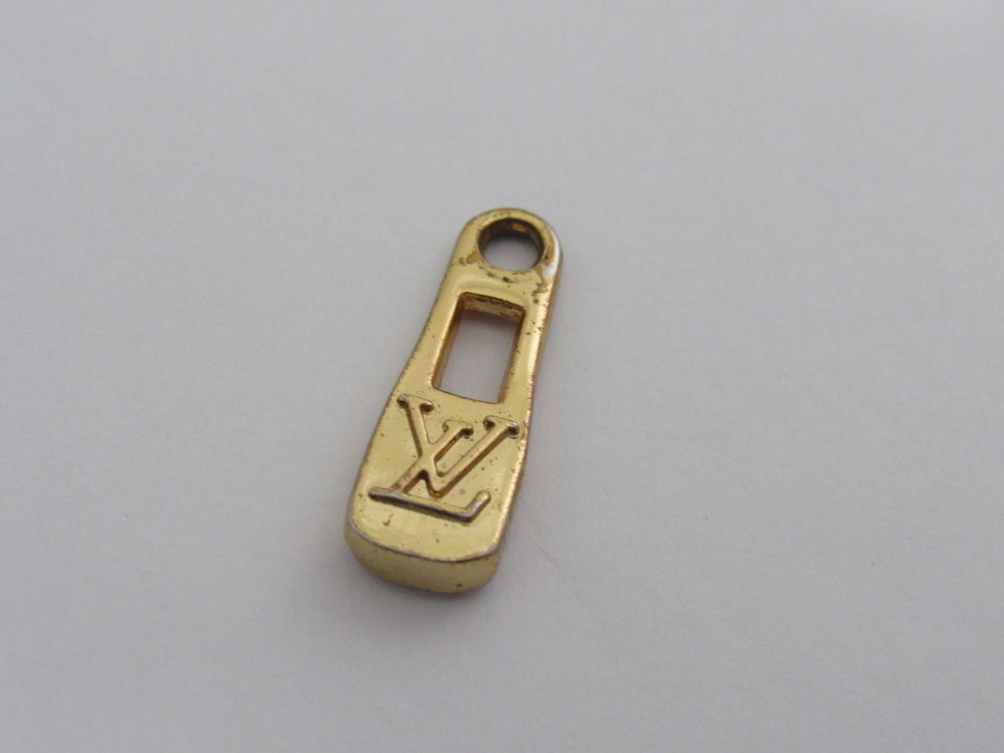 Vintage Louis Vuitton Gold Tone Embossed Bottle Cap Zipper!