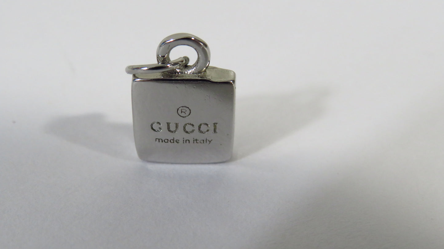 Gucci pendant on a white background