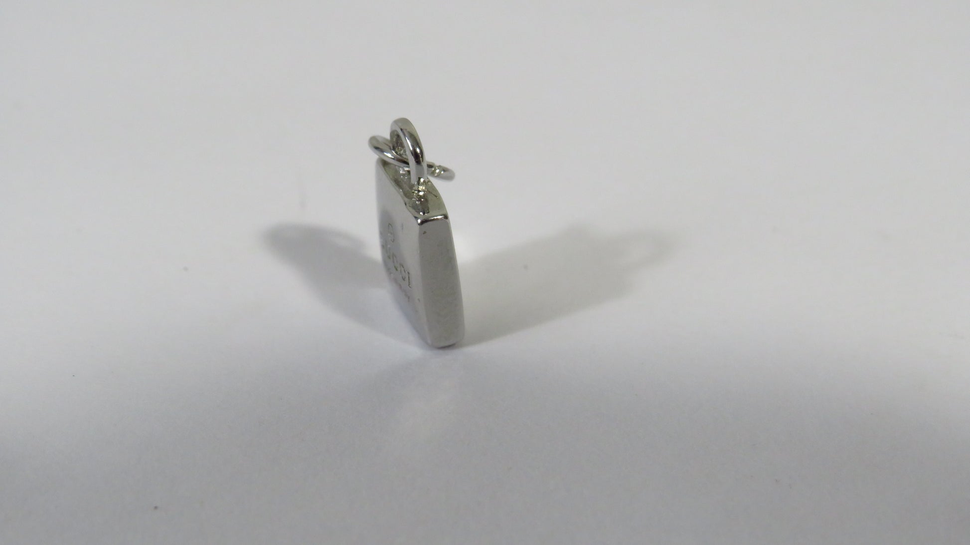 Silver pendant on a white background