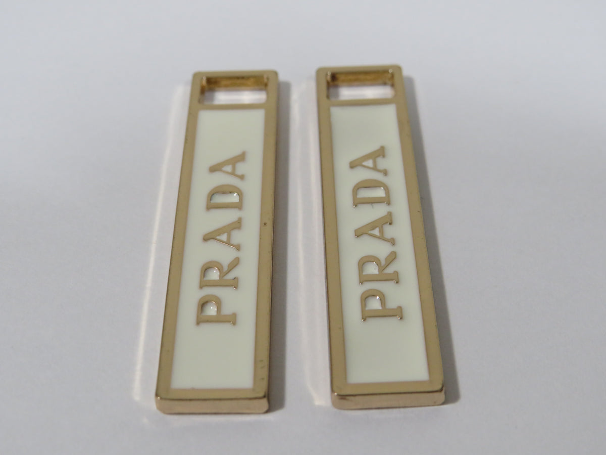 Bundle Of 2 Prada Gold And Cream Zipper Pulls!