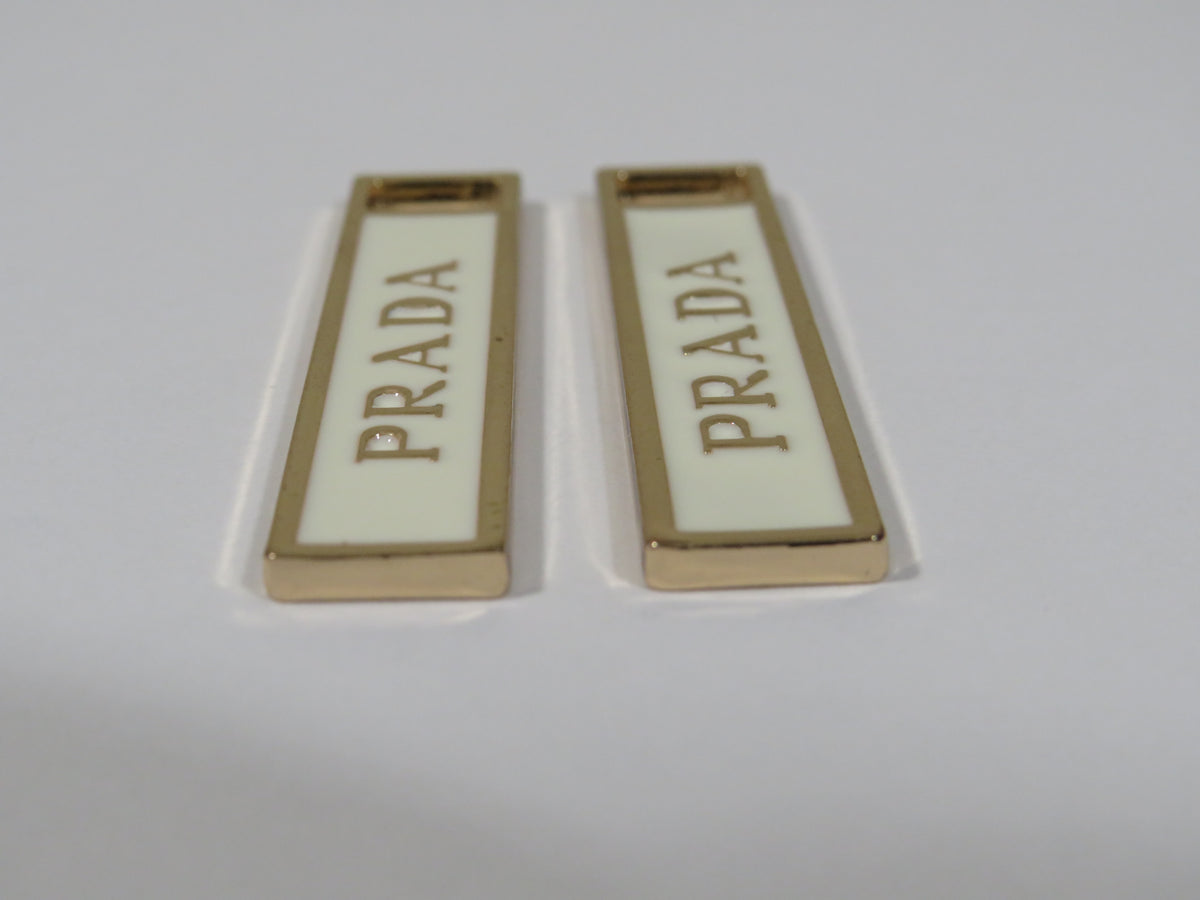 Bundle Of 2 Prada Gold And Cream Zipper Pulls!