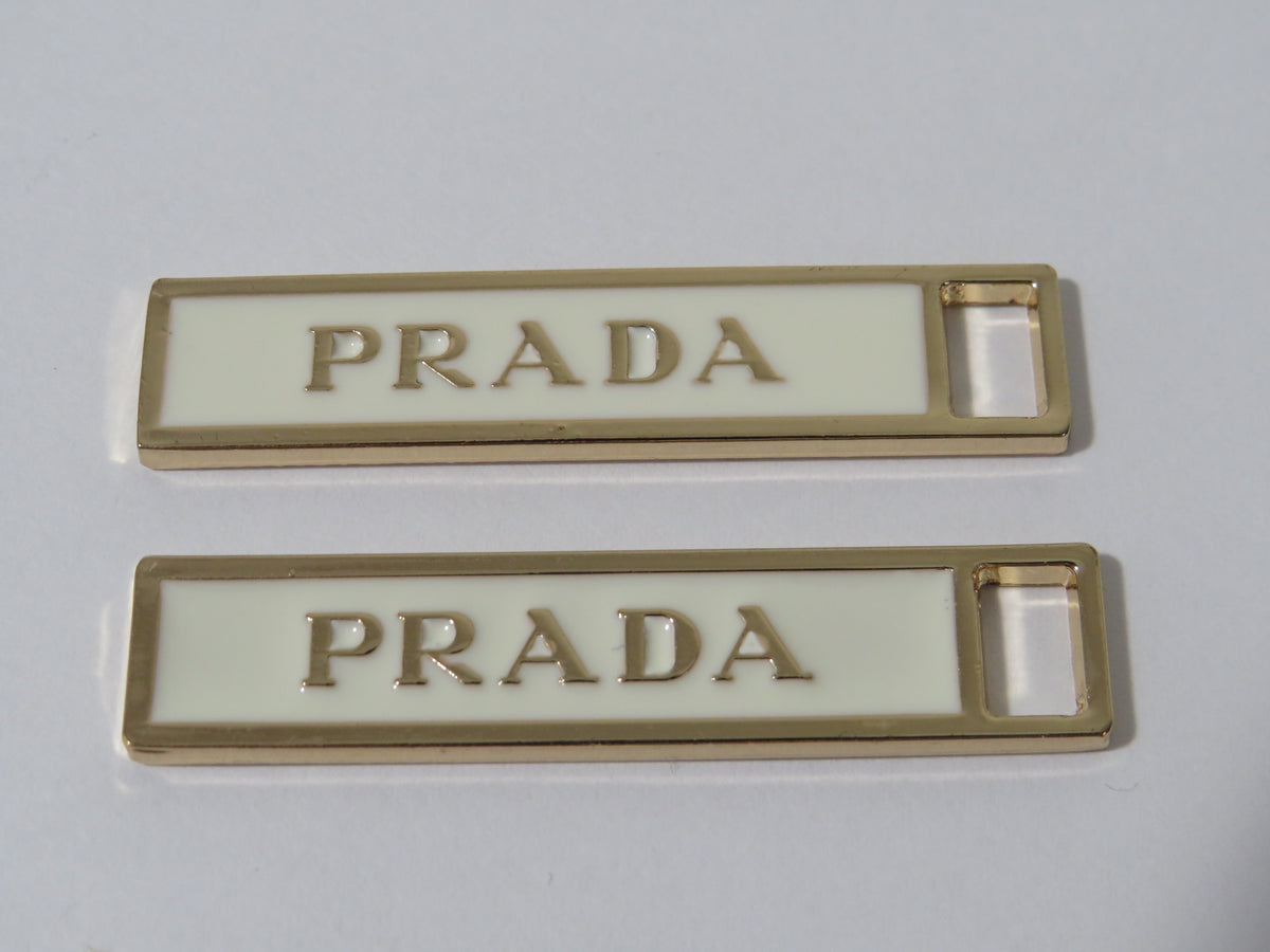 Bundle Of 2 Prada Gold And Cream Zipper Pulls!