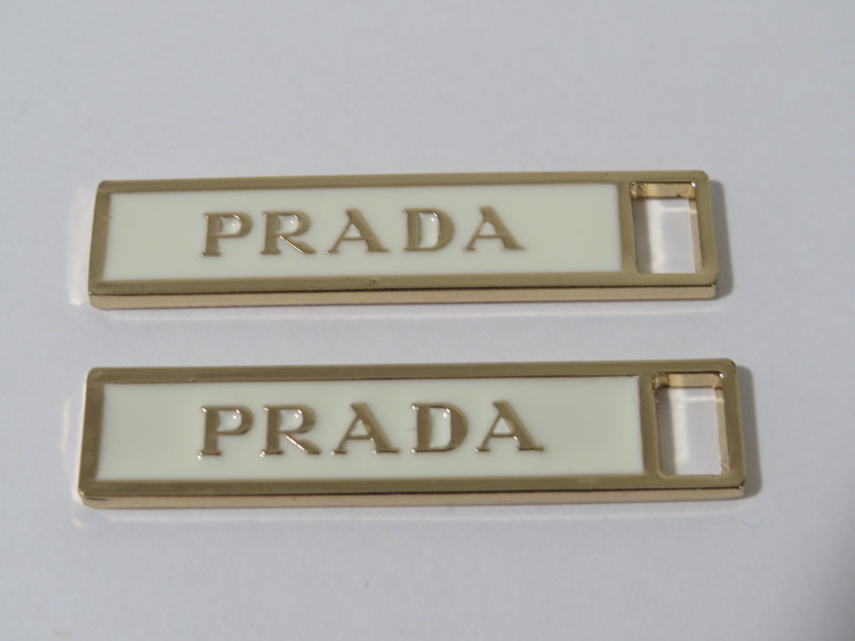 Bundle Of 2 Prada Gold And Cream Zipper Pulls!