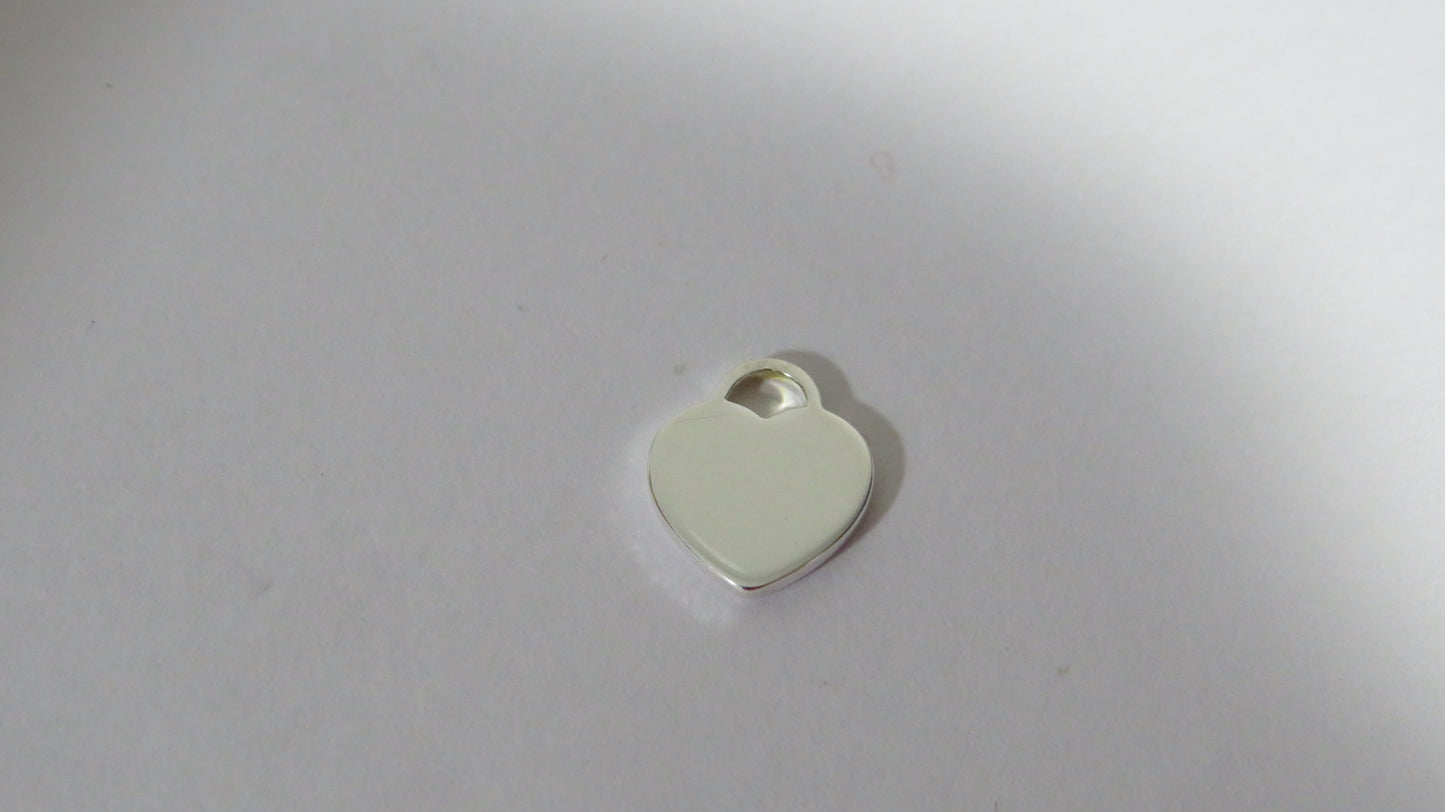 Tiffany And Co. Tiny Sterling Engraved Heart Charm!