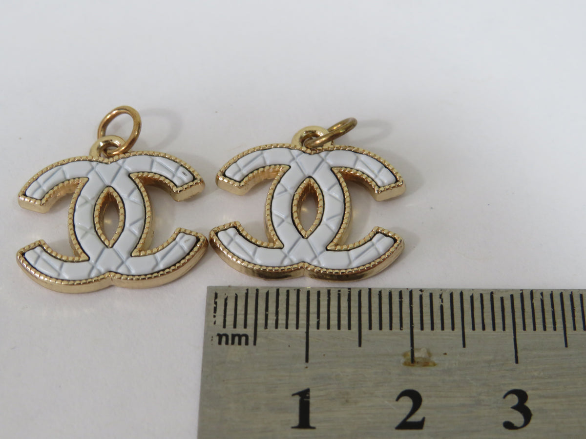 Bundle Of 2 Chanel CC White And Gold Stamped Zipper Pulls!