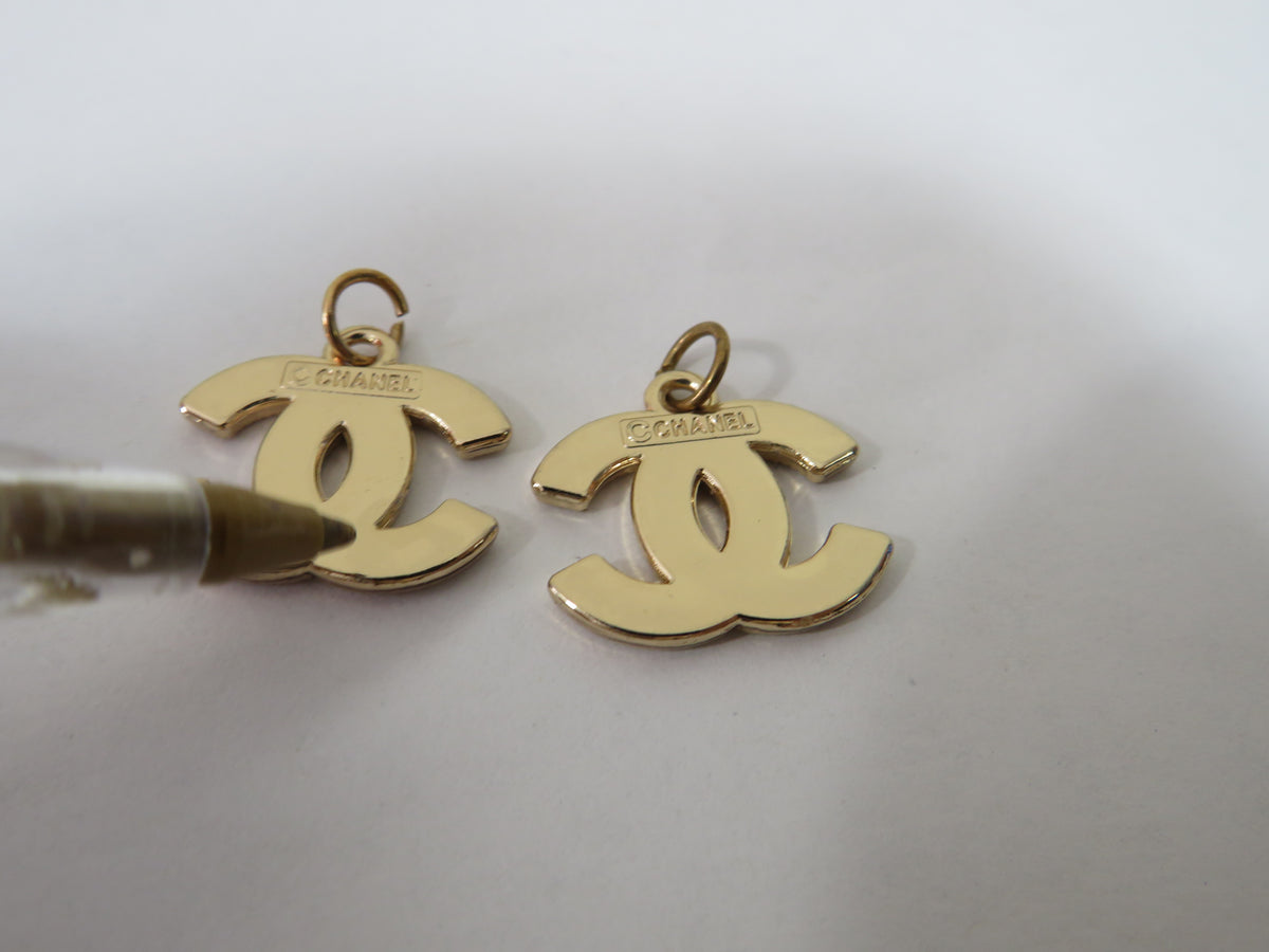Bundle Of 2 Chanel CC White And Gold Stamped Zipper Pulls!