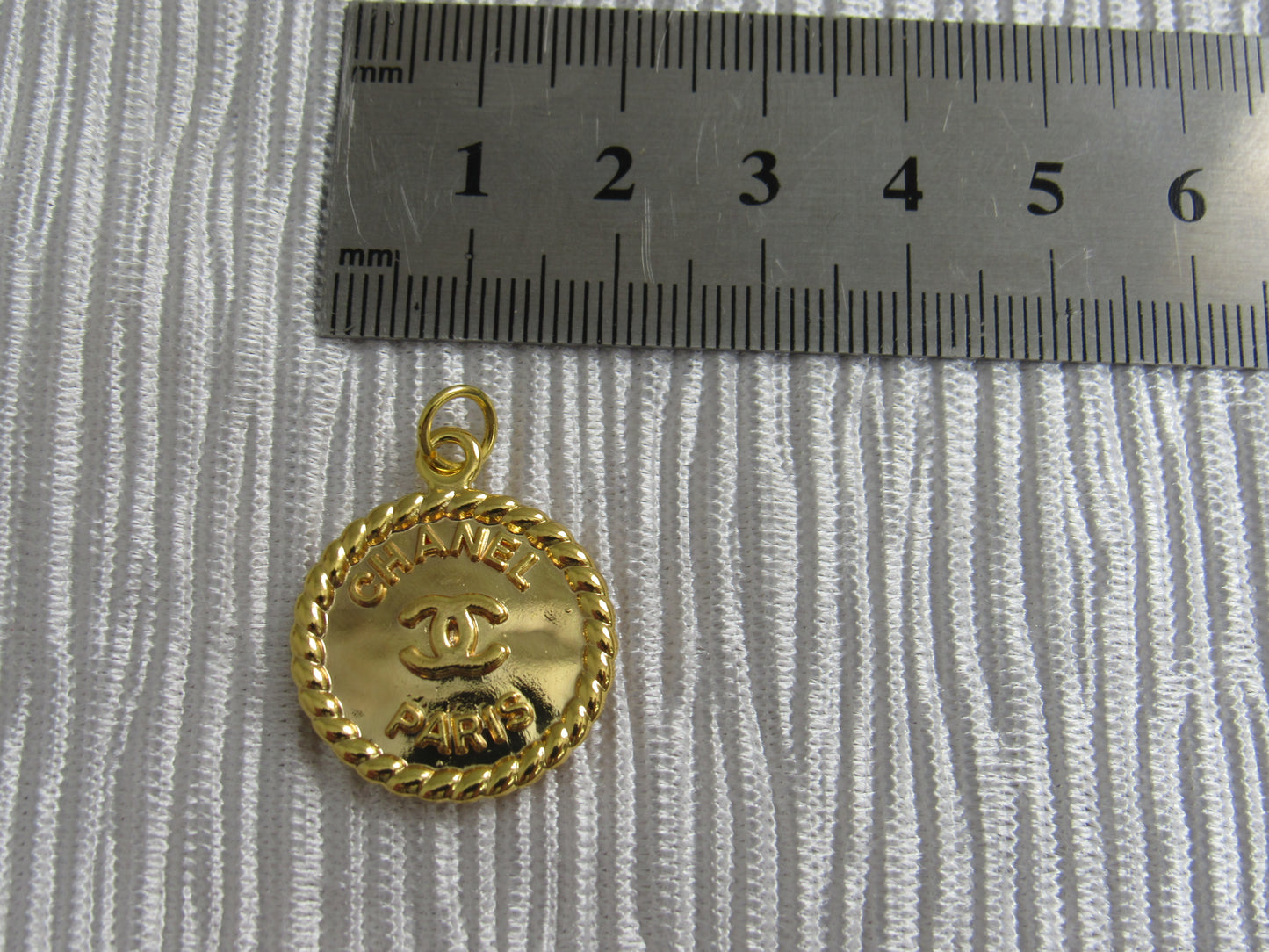 Chanel Embossed Gold Tone Medallion Zipper Pull Charm!